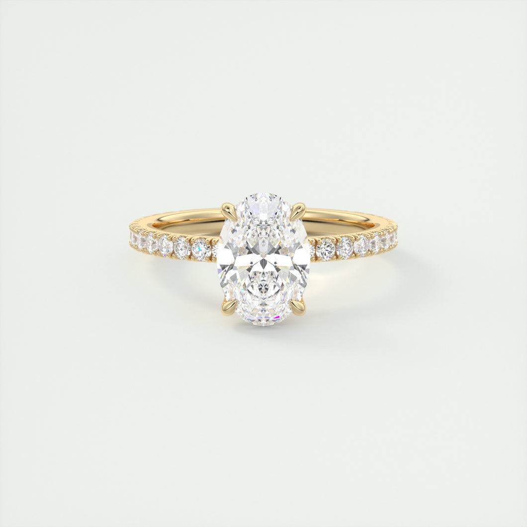 Oval cut solitaire Frank Darling lab grown diamond engagement ring with floral prongs, low profile basket and 1.8mm 3/4 french pave band in yellow gold