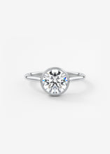 Vintage inspired round bezel set Frank Darling diamond engagement ring with millgrain detailing and a low profile trellis basket in platinum