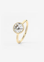 Vintage inspired round bezel set Frank Darling diamond engagement ring with millgrain detailing and a low profile trellis basket in yellow gold