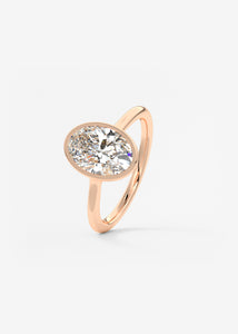Vintage inspired oval bezel set Frank Darling diamond engagement ring with millgrain detailing and a low profile trellis basket in rose gold