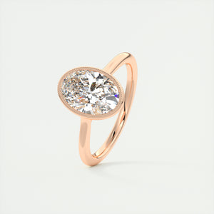 Vintage inspired oval bezel set Frank Darling diamond engagement ring with millgrain detailing and a low profile trellis basket in rose gold