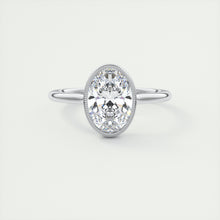 Vintage inspired oval bezel set Frank Darling diamond engagement ring with millgrain detailing and a low profile trellis basket in platinum