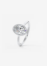 Vintage inspired oval bezel set Frank Darling diamond engagement ring with millgrain detailing and a low profile trellis basket in platinum