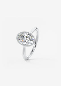 Vintage inspired oval bezel set Frank Darling diamond engagement ring with millgrain detailing and a low profile trellis basket in platinum