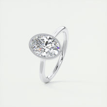 Vintage inspired oval bezel set Frank Darling diamond engagement ring with millgrain detailing and a low profile trellis basket in platinum