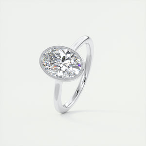 Vintage inspired oval bezel set Frank Darling diamond engagement ring with millgrain detailing and a low profile trellis basket in platinum