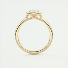 Vintage inspired oval bezel set Frank Darling diamond engagement ring with millgrain detailing and a low profile trellis basket in yellow gold