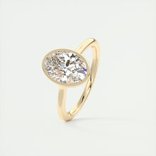 Vintage inspired oval bezel set Frank Darling diamond engagement ring with millgrain detailing and a low profile trellis basket in yellow gold