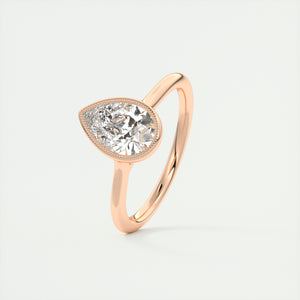 Vintage inspired pear bezel set Frank Darling diamond engagement ring with millgrain detailing and a low profile trellis basket in rose gold