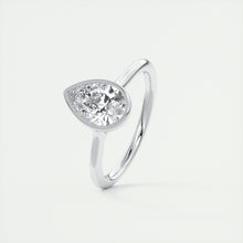Vintage inspired pear bezel set Frank Darling diamond engagement ring with millgrain detailing and a low profile trellis basket in platinum