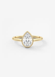Vintage inspired pear bezel set Frank Darling diamond engagement ring with millgrain detailing and a low profile trellis basket in yellow gold