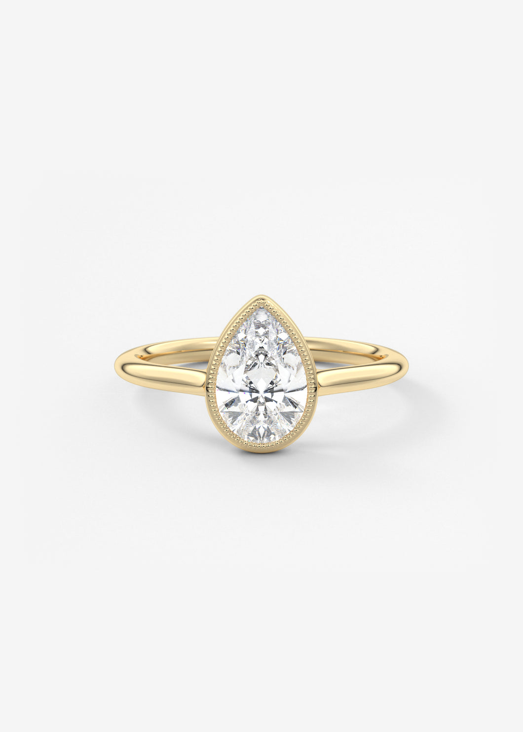 Vintage inspired pear bezel set Frank Darling diamond engagement ring with millgrain detailing and a low profile trellis basket in yellow gold