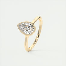 Vintage inspired pear bezel set Frank Darling diamond engagement ring with millgrain detailing and a low profile trellis basket in yellow gold