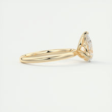Pear cut solitaire Frank Darling lab grown diamond engagement ring with floral prongs, low profile basket and 1.8mm round band in yellow gold
