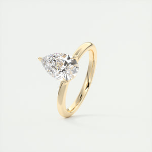 Pear cut solitaire Frank Darling lab grown diamond engagement ring with floral prongs, low profile basket and 1.8mm round band in yellow gold