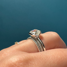 Frank darling Asscher clutch in platinum paired with half carat diamond eternity band