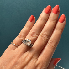 Frank darling Asscher clutch in platinum paired with half carat diamond eternity band