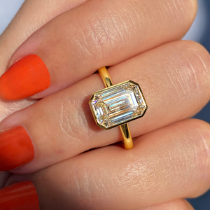 Floating emerald cut bezel Frank Darling diamond engagement ring yellow gold